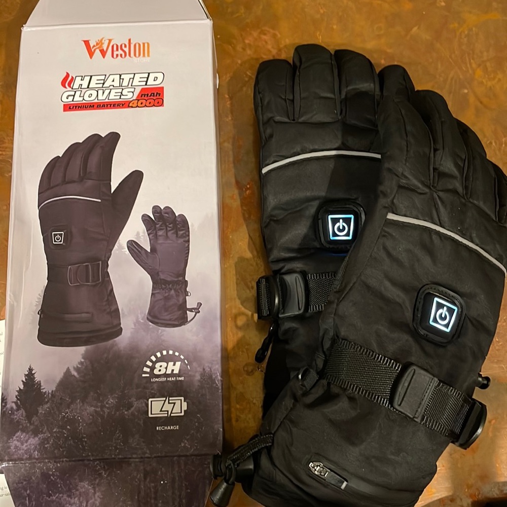 Weston brand heated gloves, brand new. Unisex size medium. Never worn.